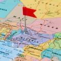 Photo of Nigeria marked by red flag in holder. Country on African continent.