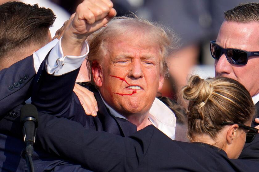 FILE - Republican presidential candidate former President Donald Trump reacts following an assassination attempt at a campaign event in Butler, Pa., on Saturday, July 13, 2024. Trump Media surged in the first day of trading, Monday, July 15, following the