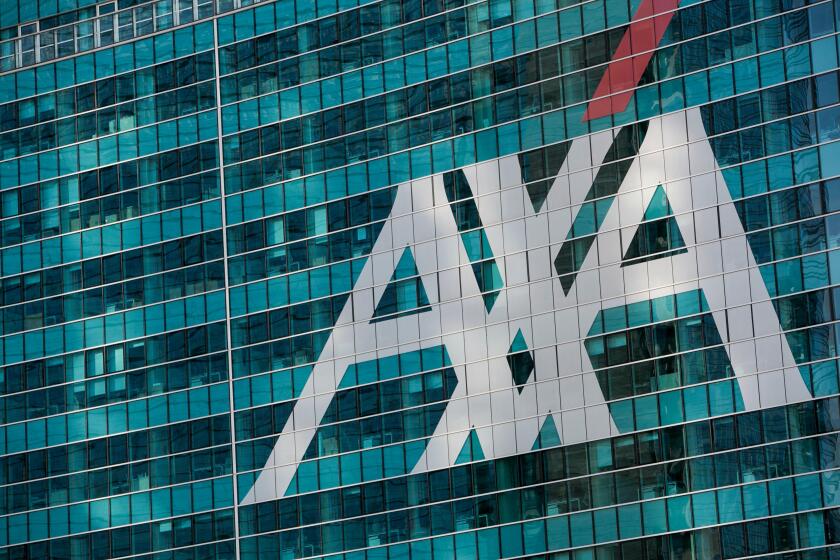 A logo sign outside of a facility occupied by AXA in Milan, Italy on September 3, 2016.