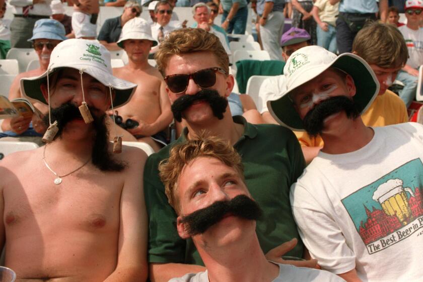 FANS WEARING MERV HUGHES TYPE FALSE MOUSTACHES AT ENGLAND v AUSTRALIA MATCH