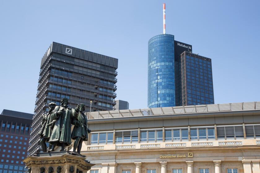 Statue beneath Financial district skyscrapers with Deutsche Bank building and Main Tower Helaba, Frankfurt am Main, Hessen, Germ