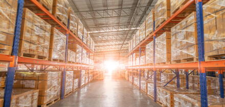 Full of goods stock in warehouse industrial and logistics background. Commercial Storage area. Large products distribution Inventory cargo shelves.