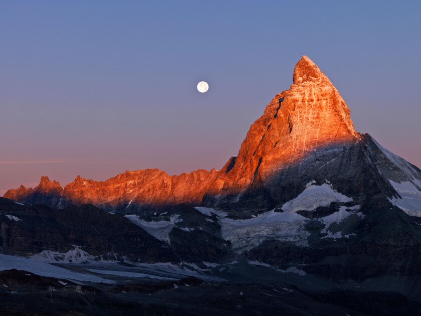 Switzerland, Valais, Zermatt, the Gornergrat,moon setting over the Matterhorn at dawn