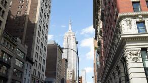 the burton building looking up 5th avenue with view of the empire state building New York City USA