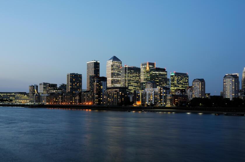 Canary Wharf skyline at dusk, from the South Bank of the Thames