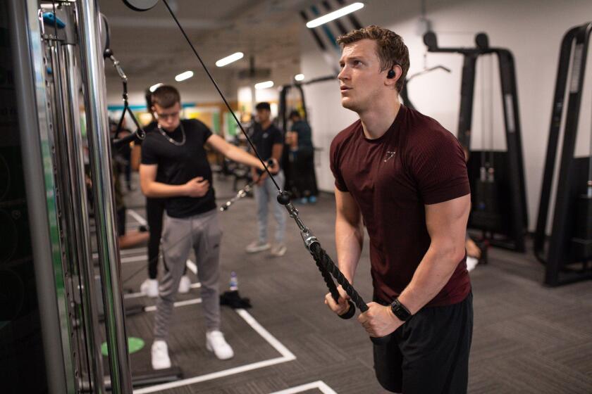 Gym members exercise at PureGym in Leamington Spa, which is re-opening as indoor gyms, swimming pools and sports facilities can reopen as part of the latest easing of coronavirus lockdown measures in England.