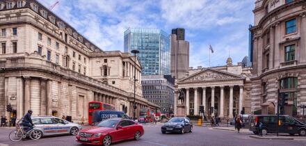 Traffic in Threadneedle Street, London, with the Bank of England, and the Royal Exchange.