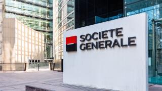 Sign of the Societe Generale at the entrance of the head office of the french banking group in La Defense business district.