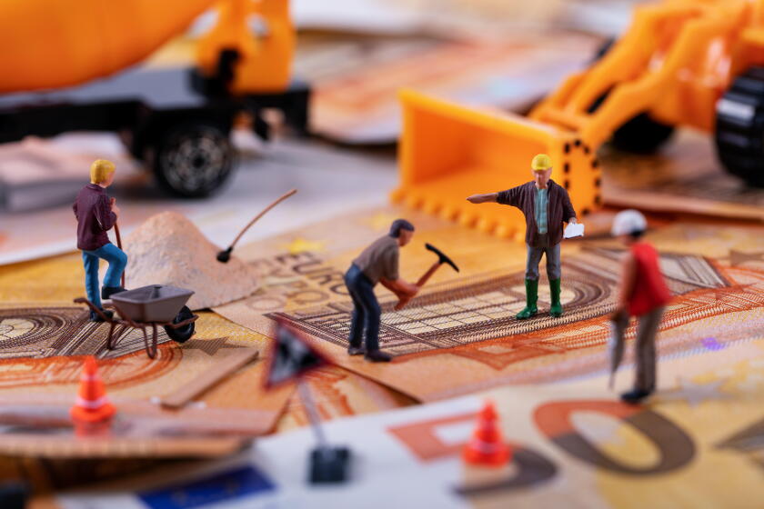 construction business concept - workers team working hard to earn more money