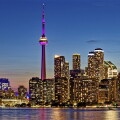 CN Tower dominates skyline of Harbourfront and Downtown Toronto, viewed from Wards Island.