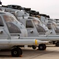 Military Helicopters lined up in a row