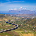 The Autostrade as it winds its way along the North Sicilian coast from the Greek Theater at Segesta, Sicily