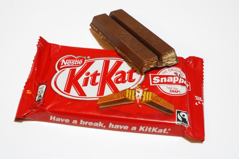 KitKat bars of chocolate, UK confection wafer bar, candy bar, edible food snack