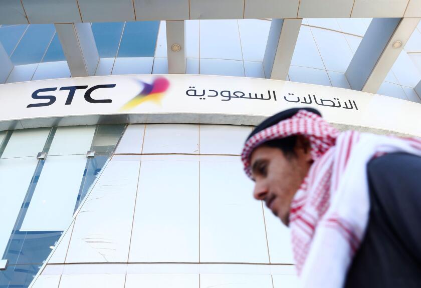 A man passes the Saudi Telecom STC office in Riyadh, Saudi Arabia February 6, 2018. REUTERS/Faisal Al Nasser