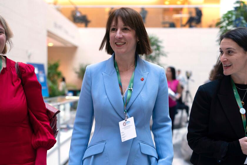 Britain's Chancellor of the Exchequer Rachel Reeves, center, leaves the G20 meeting during the World Bank/IMF Annual Meetings in Washington, Thursday, Oct. 24, 2024. (AP Photo/Jose Luis Magana)