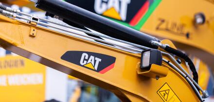 MUNICH / GERMANY - APRIL 14, 2019: Caterpillar logo on a digger arm at a CAT machine dealer.
