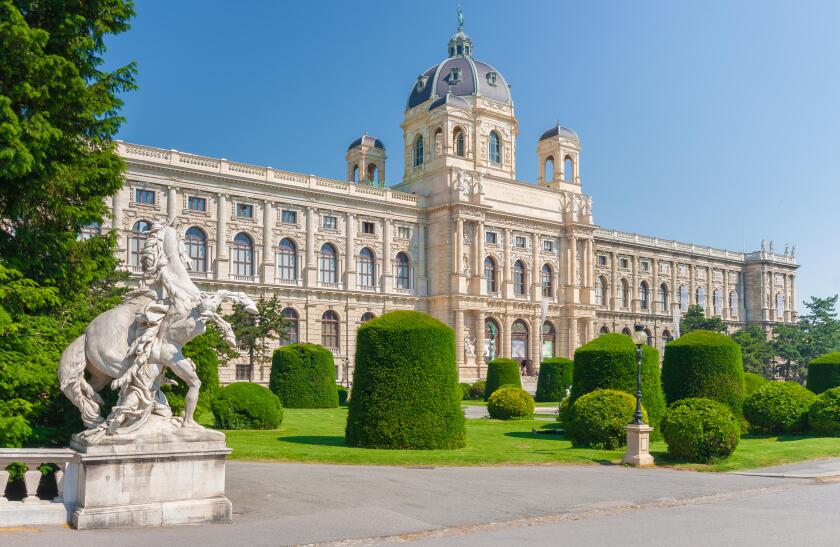 Classic view of famous Naturhistorisches Museum (Natural History Museum) with park and sculpture in Vienna, Austria