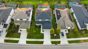 Wealthy neighborhood with expensive houses in southern Florida. Development of US premium housing market