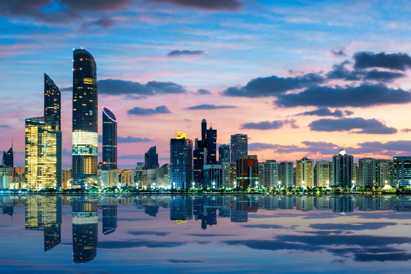 View of Abu Dhabi Skyline at sunset, United Arab Emirates