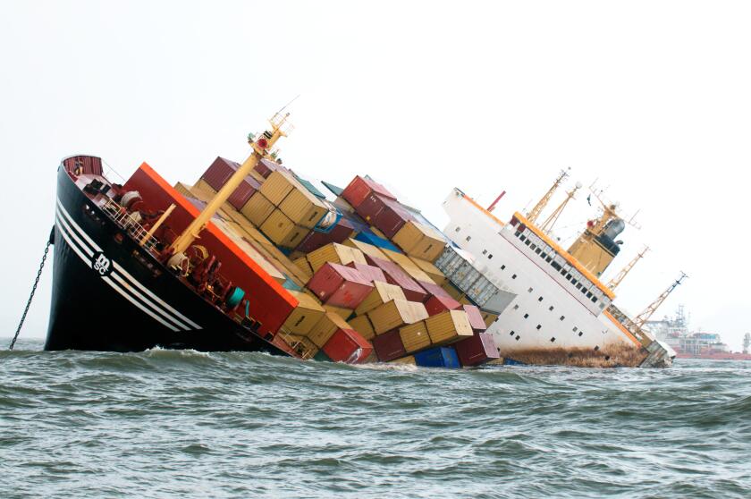 Container ship sinking tilted dangerously after colliding accident in Arabian Sea Bombay Mumbai Maharashtra India Asia Indian accident Asian