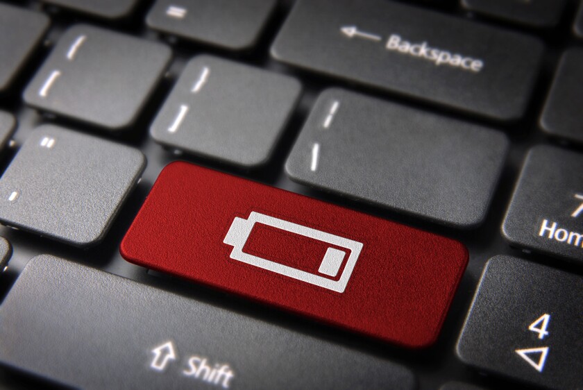 Technology key with low battery icon on laptop keyboard. Included clipping path, so you can easily edit it.