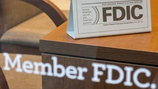 Bank Member FDIC Sign on Window and Desk, USA. Image shot 2013. Exact date unknown.