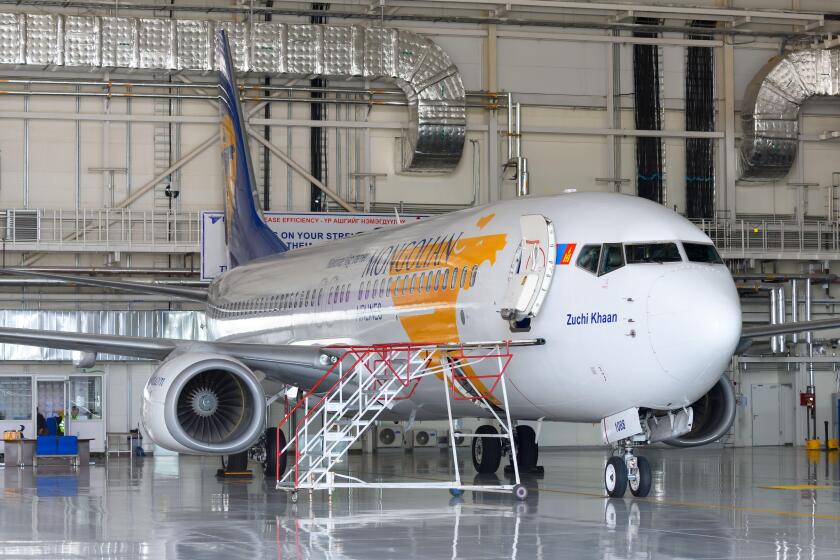 MIAT Mongolian Boeing 737 inside the maintenance hangar at Ulaanbaatar Airport. Aircraft hangar for MIAT Mongolian.  MIAT Mongolian Airlines MRO.