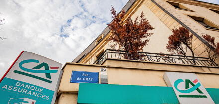 Credit Agricole and Banque Assurances signs on a building corner, Bourgogne-Franche-Comte, Dijon, France