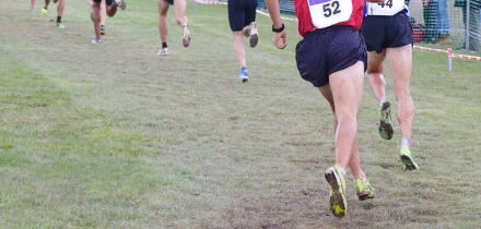 Several male athletes in a popular cross-country race