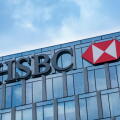 Milan, Italy: HSBC bank logo on the building of company headquarters in Milan