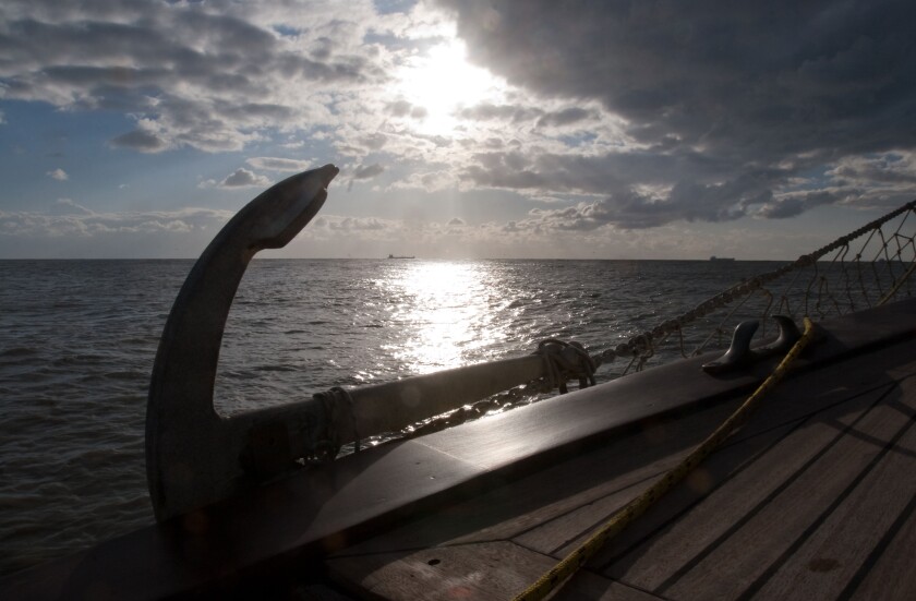 Tyrrhenian sea anchor on boat in backlight back light sunshine seascape seaside boats sea marine sail sailing cloudy sky weather