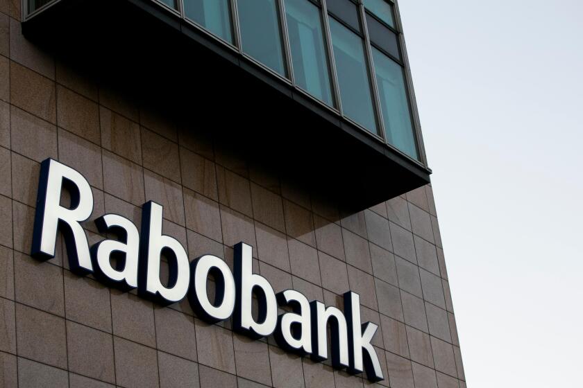 A logo sign outside of an office building occupied by Rabobank in Amsterdam, Netherlands on October 2, 2015