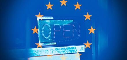 Open sign in the middle of the European Flag, concept of Re-opening in Europe after Coronavirus.
