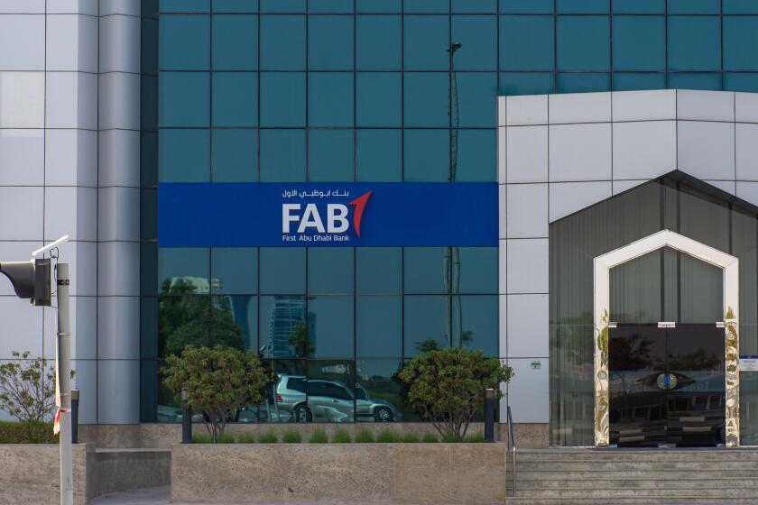 "Ras al Khaimah, Ras al Khaimah/United Arab Emirates - 7/4/2019: "First Abu Dhabi (FAB) Bank blue close up storefront sign and entrance. "