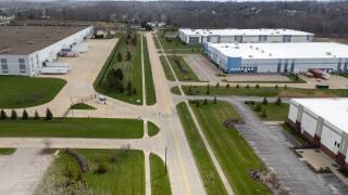 Aerial view of industrial warehouses and parking