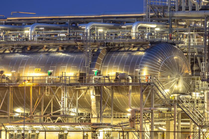 Giant container in Chemical factory at night. Petrochemical background.