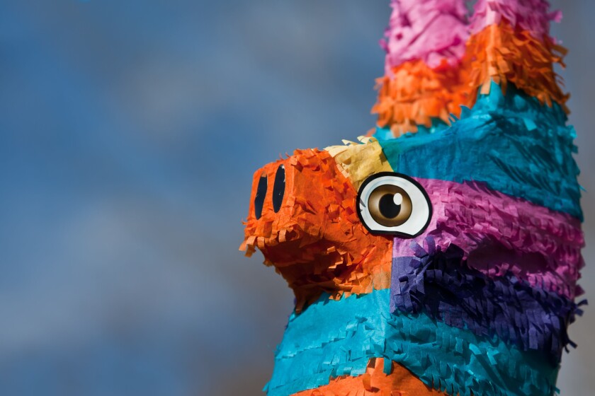 A close up shot of the head of a festive pinata.