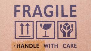 Cardboard Box With Fragile Stamp and Symbols.