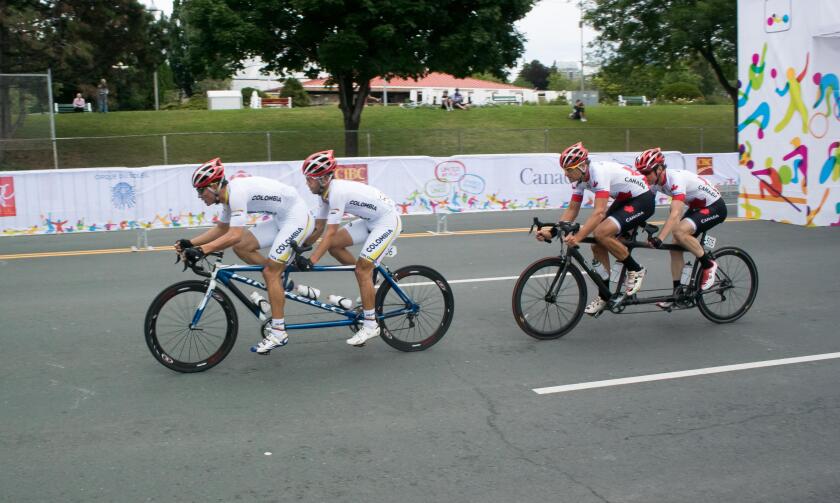 8 August 2015: TO2015 Panam Games, Cycle road race, Sebastian Durango and Nelso Serna (COL) lead Daniel Chalifour and Alexandre