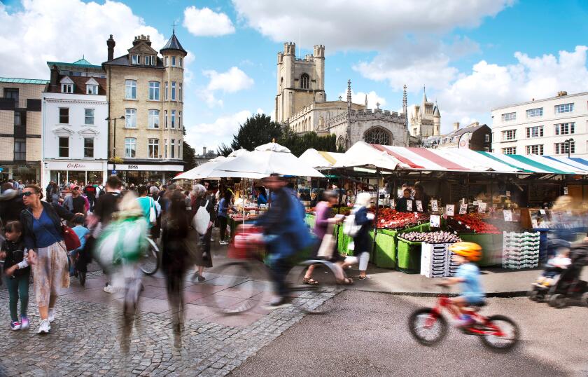 Cambridge Market on a busy saturday in Summer.Tourists and locals alike visit the market and are blurred through a long exposure