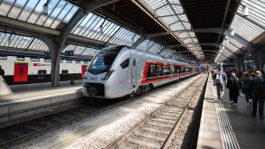 Zurich, Switzerland, April 23, 2026. Commuters walk along the platform at Zurich Main Station past a copper-colored SOB Traverso train parked under th