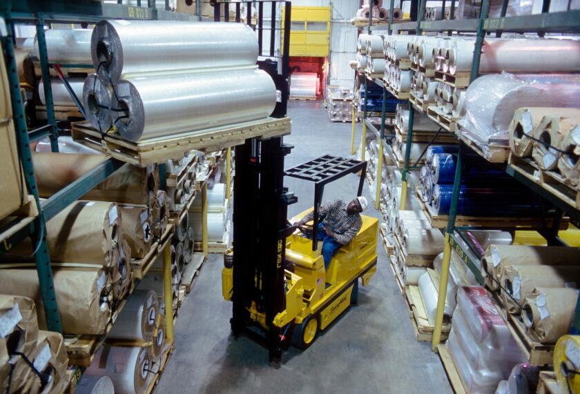 Forklift working in a large distribution warehouse