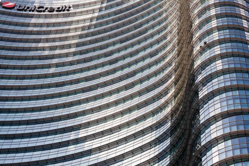 UniCredit Tower in the Porta Nuova District, Milan, Lombardy, Italy. Exterior view of curved glass facade of the tallest building in Italy.
