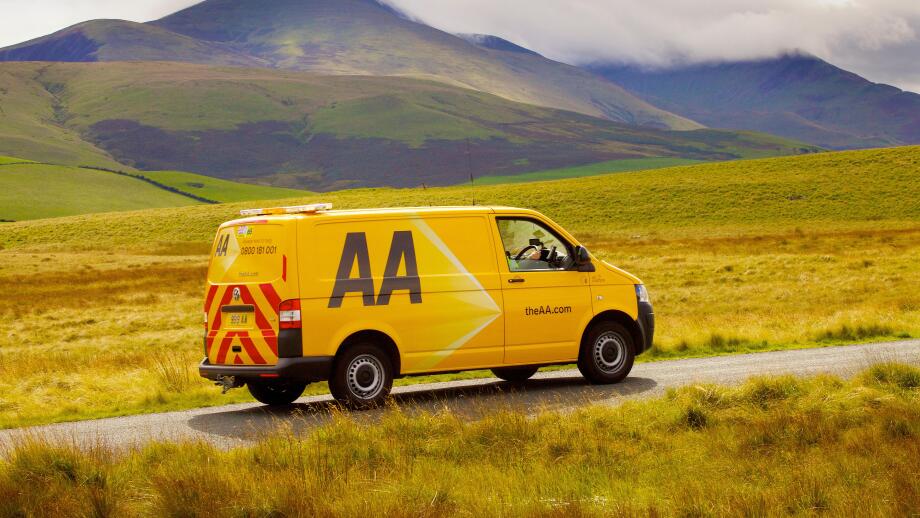 AA van on rural road. Aughertree Fell, Uldale, The Lake District National Park, Cumbria, England, United Kingdom, Europe.