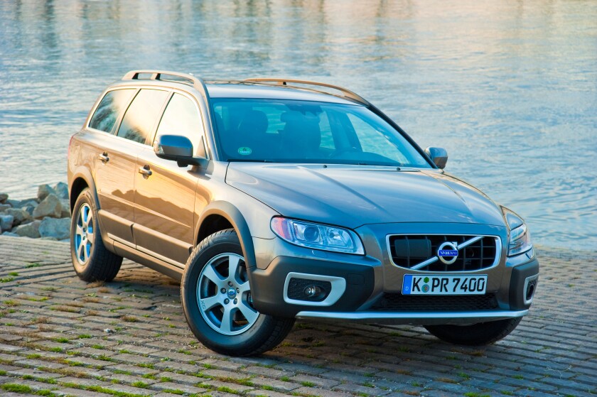 Front and side view of Volvo XC 70 four wheel drive station waggon in sunset parked in front of Rhine river. Image shot 2009. Exact date unknown.