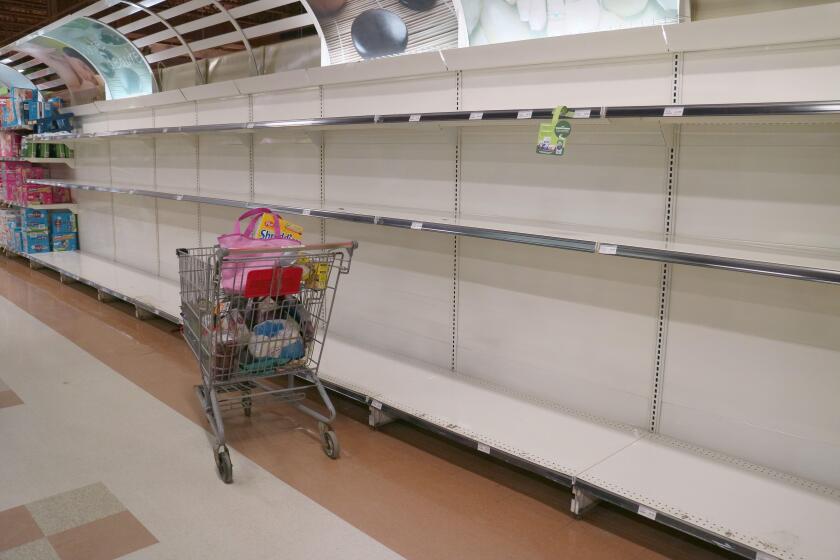 Empty shelves in a supermarket in Quebec City as people panic buy in response to the Covid-19 hysteria.