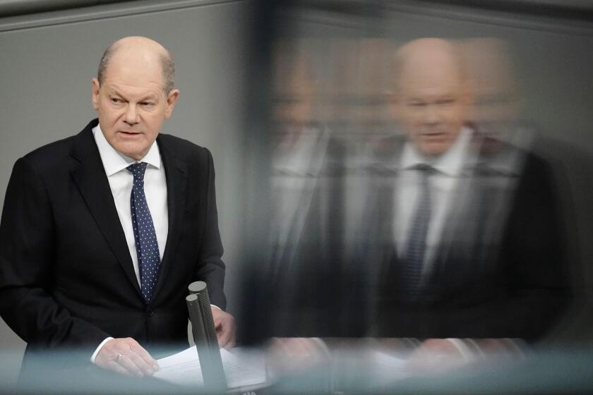FILE - Germany's Chancellor Olaf Scholz makes a government statement in the Bundestag, Berlin, Wednesday, Dec. 13, 2023. German Chancellor Olaf Scholz is calling for calm and a readiness to accept compromises as the country faces protests by farmers angry