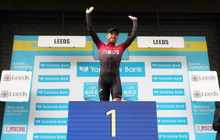 Team Ineos' Chris Lawless takes the podium after winning overall during stage four of the Tour de Yorkshire.