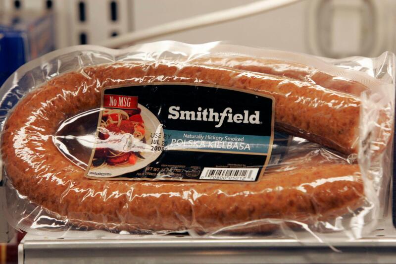 Smithfield Foods products are displayed at a local grocery store Thursday, June 5, 2008, in Columbia, S.C. Simthfield Foods Corp., the nation's largest hog producer and pork processor, said Thursday that fourth-quarter profits fell 94 percent, hurt by ris