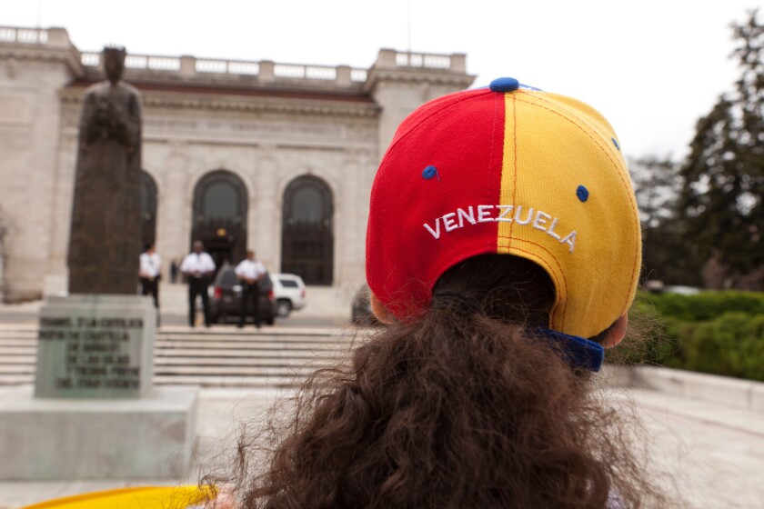 Woman wearing Venezuela cap